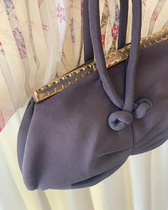 Studded lucite handbag